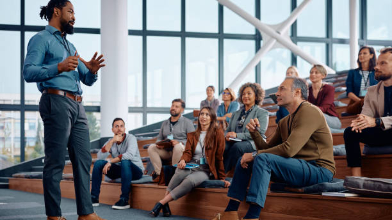 African American  telling the story of a product at a seminar