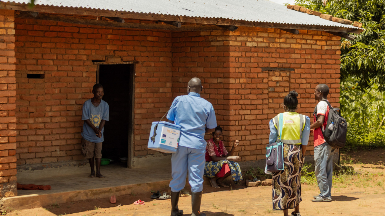 Joseph Simwaka senior  health surveillance assistant at chitipa hospital and chrissy Nshala health surveillance assistant at Namasasa village at the homw of veronica ngwira, 24 checking if her child has received the polio vaccine
